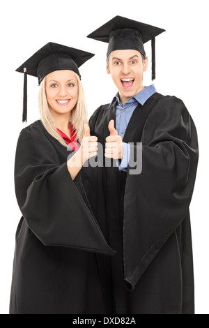 Male and female college students giving thumbs up Stock Photo