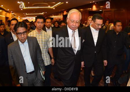 Kuala Lumpur, Malaysia. 24th Mar, 2014. Malaysian Prime Minister Najib Razak leaves the press conference in Kuala Lumpur, Malaysia, March 24, 2014. New analysis of statellite data suggested that the missing Malaysia Airlines Flight MH370 'ended' in the southerni Indian Ocean, said Malaysian Prime Minister Najib Razak on Monday. Credit:  Chong Voon Chung/Xinhua/Alamy Live News Stock Photo