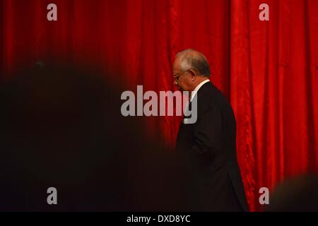 Kuala Lumpur, Malaysia. 24th Mar, 2014. Malaysian Prime Minister Najib Razak leaves the press conference in Kuala Lumpur, Malaysia, March 24, 2014. New analysis of statellite data suggested that the missing Malaysia Airlines Flight MH370 'ended' in the southerni Indian Ocean, said Malaysian Prime Minister Najib Razak on Monday. Credit:  Chong Voon Chung/Xinhua/Alamy Live News Stock Photo