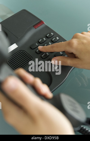 Closeup of woman's hands telephoning Stock Photo