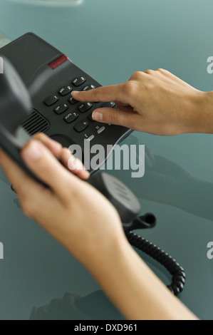 Closeup of woman's hands telephoning Stock Photo