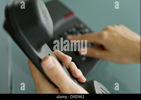 Closeup of woman's hands telephoning Stock Photo