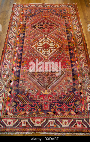 Antique hand made rug from Iran Stock Photo