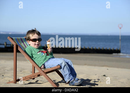 Portobello Beach, Edingburgh, Scotland, UK . 24th Mar, 2014. Too Soon for a weather picture? This time last year motorists across the UK were digging their cars out of the snow with temperatures just above freezing.  Louis O'Brien, 2,  relaxes in his deckchair and enjoys an ice cream on Portobello Beach in Edinburgh with the temperature in Edinburgh at 10.2C and London 11.5C as Spring weather finally arrives. Credit:  pictureditor/Alamy Live News Stock Photo