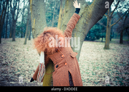 young beautiful red curly hair woman at the park Stock Photo