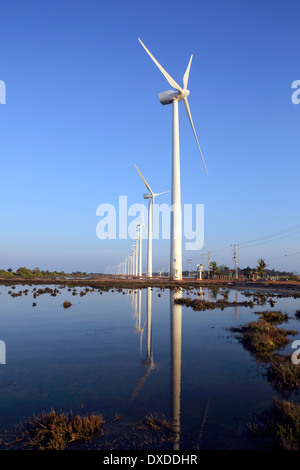 Turbines and salt ponds at wind farm on the edge of Puttalam Lagoon in Sri Lanka Stock Photo