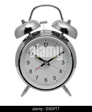 Traditional chrome metal Alarm Clock with bells and ringer on top to awaken you from sleep in the morning Stock Photo