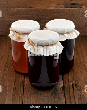 Traditional homemade Fruit Jam jars a popular fruit preserve often sold at country fairs and charity bake sales Stock Photo