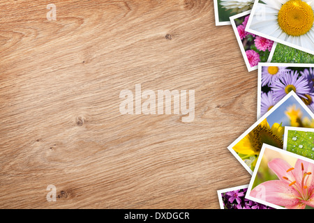 Stack of printed pictures collage on wooden table with copy space for your text or photo Stock Photo