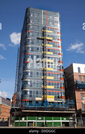 Manchester 7th March, 2014.  Sarah Point Nuovo being built on Gt Ancoats Street, by client Sir Robert McAlpine comprising a 13-storey tower and two lower blocks, this part-built dormant scheme has been on hold for several years. Now Forming part of a wider regeneration scheme for the Ancoats area, Nuovo Apartments will provide 166 high specification apartments, 40 of which will be affordable homes, along with ground-floor commercial space. Stock Photo