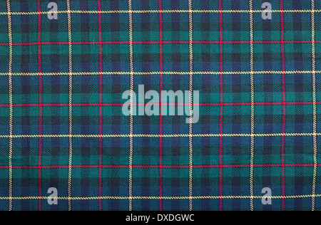 Scottish tartan background a checked plaid weave pattern with red, green blue and yellow colours. Stock Photo