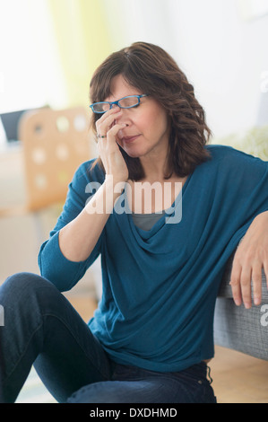 Woman having headache Stock Photo