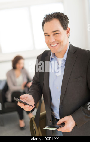 Businessman at airport Stock Photo