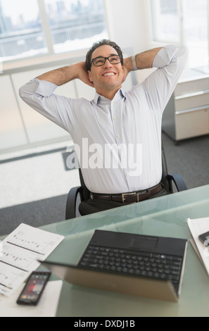 Businessman using laptop and digital tablet Stock Photo
