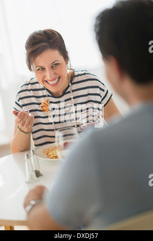 Couple eating spaghetti Stock Photo