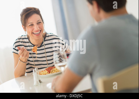 Couple eating spaghetti Stock Photo