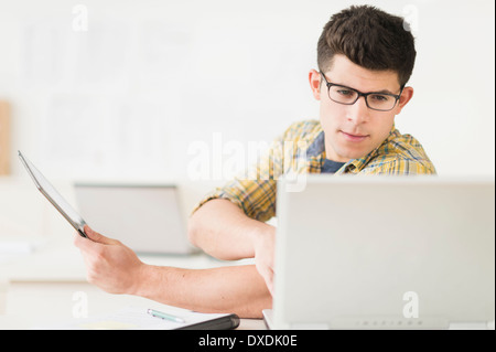 Young man using tablet Stock Photo