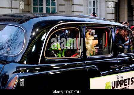 Mayfair, London, UK . 24th Mar, 2014. Constantine, Kermit and Miss Piggy arrive by Black Cab. The stars of 'Muppets Most Wanted' arrive at the Curzon Cinema in Mayfair for a VIP screening. Credit:  Rachel Megawhat/Alamy Live News Stock Photo