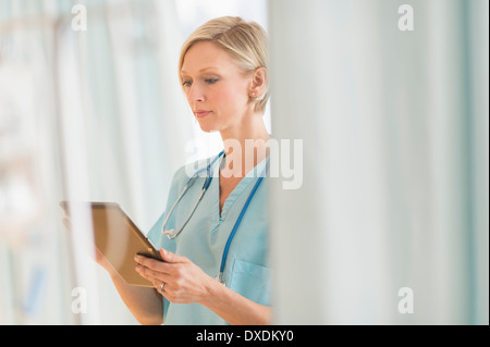 Female doctor using tablet PC Stock Photo