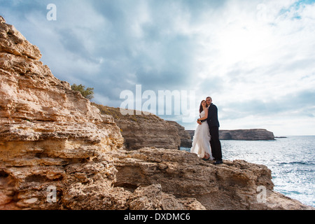 Bride and groom near the ocean Stock Photo