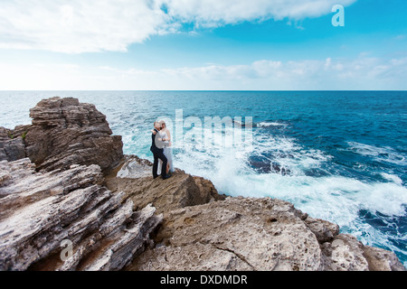 Bride and groom near the ocean Stock Photo