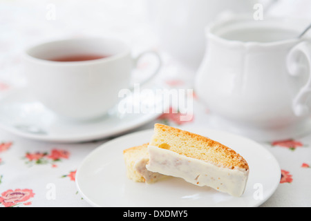 Lemon Biscotti with Cup of Tea and Sugar Bowl, Studio Shot Stock Photo