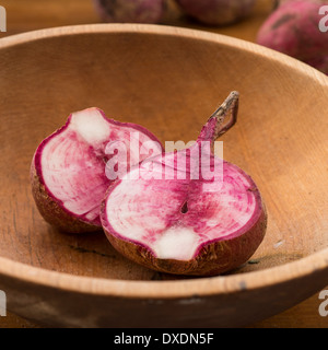 Studio shot cut Japanese red turnip in wooden bowl Stock Photo