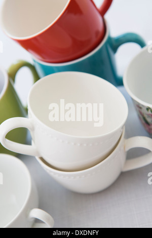 Variety of Colorful Mugs Stacked, Studio Shot Stock Photo