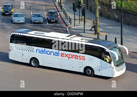 National Express coach & driver aerial view looking down driving along Hyde Park Corner road on route Luton Airport and Victoria London England UK Stock Photo