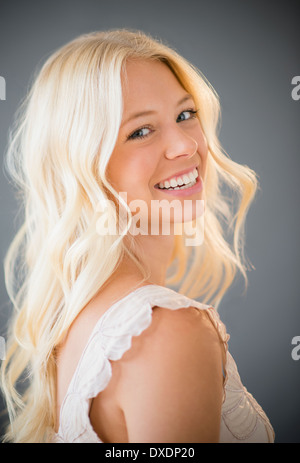 Portrait of young woman smiling Stock Photo