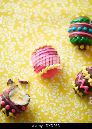 Decorated Easter eggs on floral background, studio shot Stock Photo