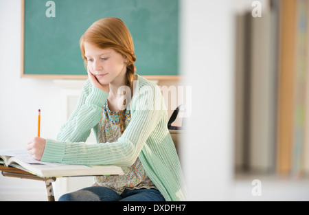 Girl (12-13) at school Stock Photo