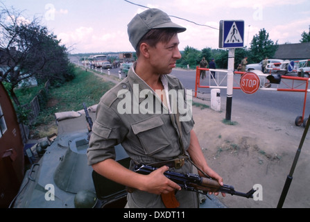 Former Soviet Soldier with rifle at the border between Transnistria and the Ukraine during the “War of Transnistria” in 1992. Stock Photo