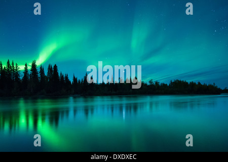 The Aurora Borealis (Northern Lights) over the Klondike River, Yukon Territories, Canada Stock Photo