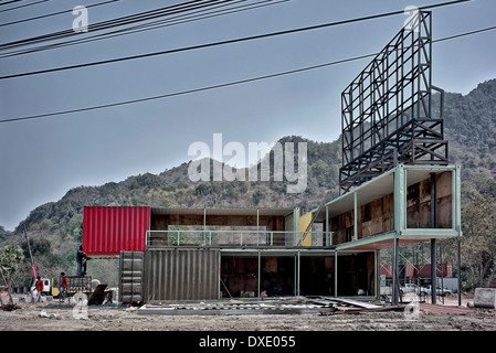 Unusual home exterior. Container house. Large metal shipping containers in the course of conversion to unusual residential homes. Thailand S. E. Asia Stock Photo