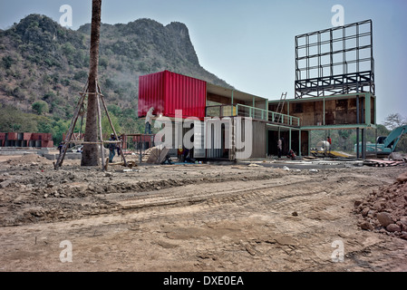 Unusual home exterior. Container house. Large metal shipping containers in the course of conversion to unusual residential homes. Thailand S. E. Asia Stock Photo