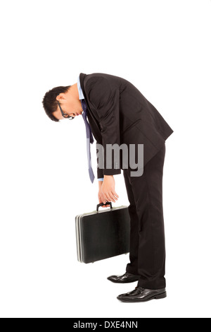 very tired businessman stoop and holding briefcase over white background Stock Photo