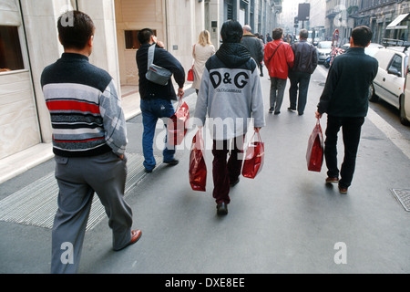 Men with shopping bags on Via Montenapoleone Milan Italy Stock Photo