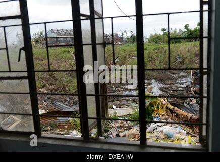 Destroyed buildings after the super typhoon Haiyan on the island leyte,10.03.2014.   Typhoon Haiyan tore through the eastern and central Philippines beginning 08 November 2013 flattening homes toppling power lines and knocking out communications. Photo: Frank May Stock Photo