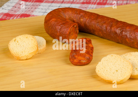 Spanish chorizo appetizer on a wooden board Stock Photo