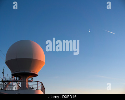 Sunset with radome on the top deck of cruise liner Caribbean Princess, sailing off Nova Scotia Canada Stock Photo