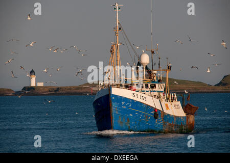 Scottish fishing boat heads back to stornoway harbour,island-of-lewis.hebrides.