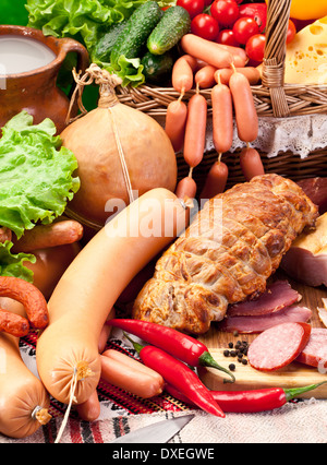 Variety of sausages with vegetables and milk products. Close up shot. Stock Photo