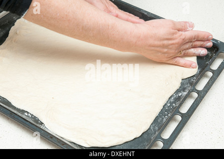 kneading dough for bread on the table Stock Photo
