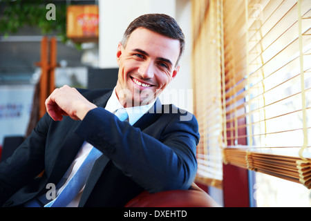 Portrait of a handsome happy businessman in suit Stock Photo