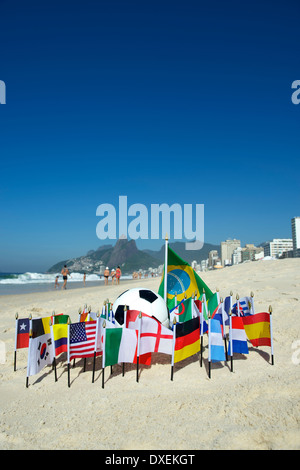 International football country flags with soccer ball on Ipanema beach in Rio de Janeiro Brazil Stock Photo