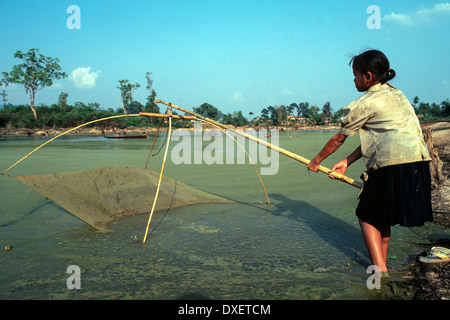 Laos woman fishing net poles hi-res stock photography and images