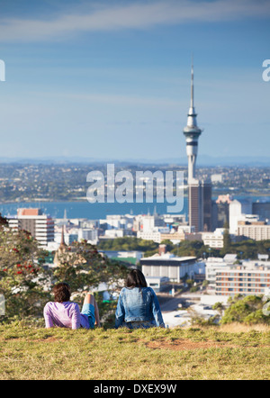 Couple enjoying view of Auckland from Mount Eden, Auckland, North Island, New Zealand Stock Photo