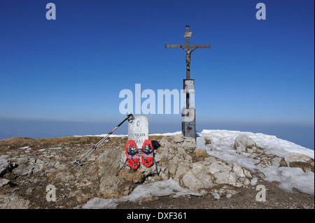 snowshoes and trekking poles at the summit of Sonntagshorn in winter, Bavaria, Germany Stock Photo