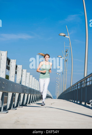 Young Woman Running, Worms, Rhineland-Palatinate, Germany Stock Photo